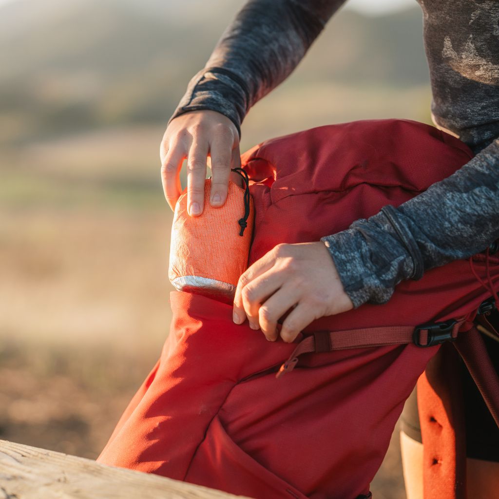 Escape Insulated Trail Seat removing Trail Seat in stuff sack from backpack