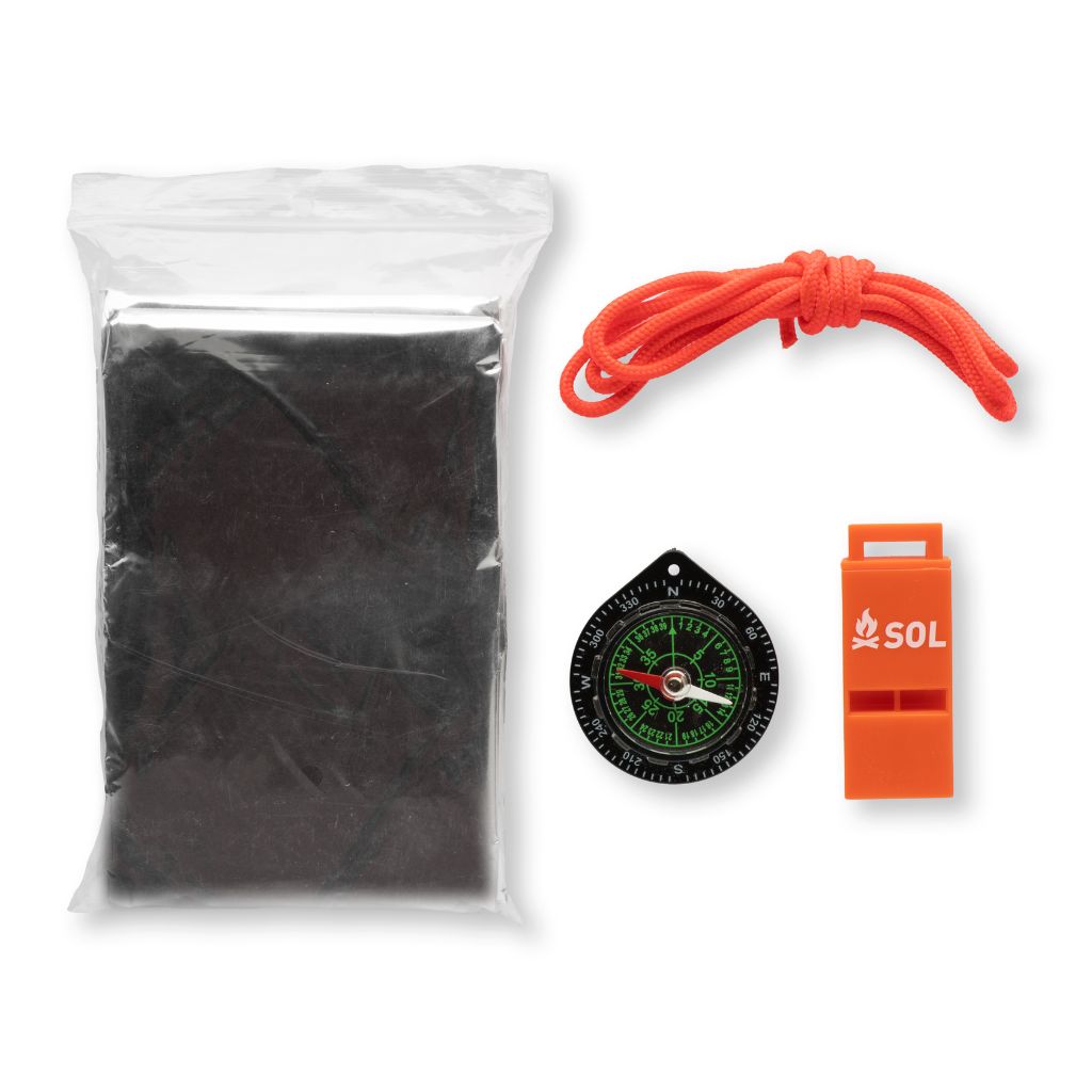 Contents of Camp Critter Kit, compass, tinder cord, whistle and emergency blanket