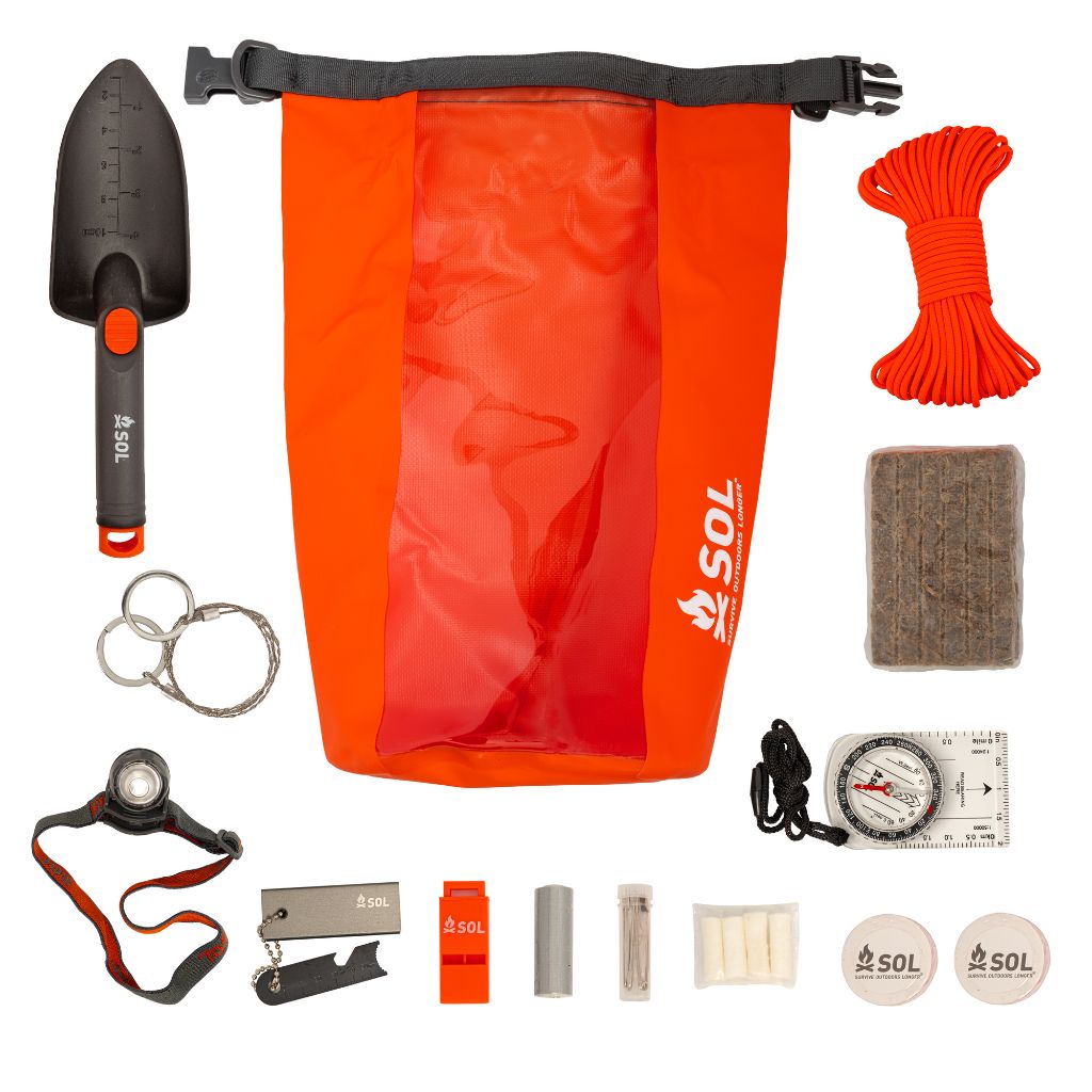 Camp Ready Survival Kit contents sitting around bag