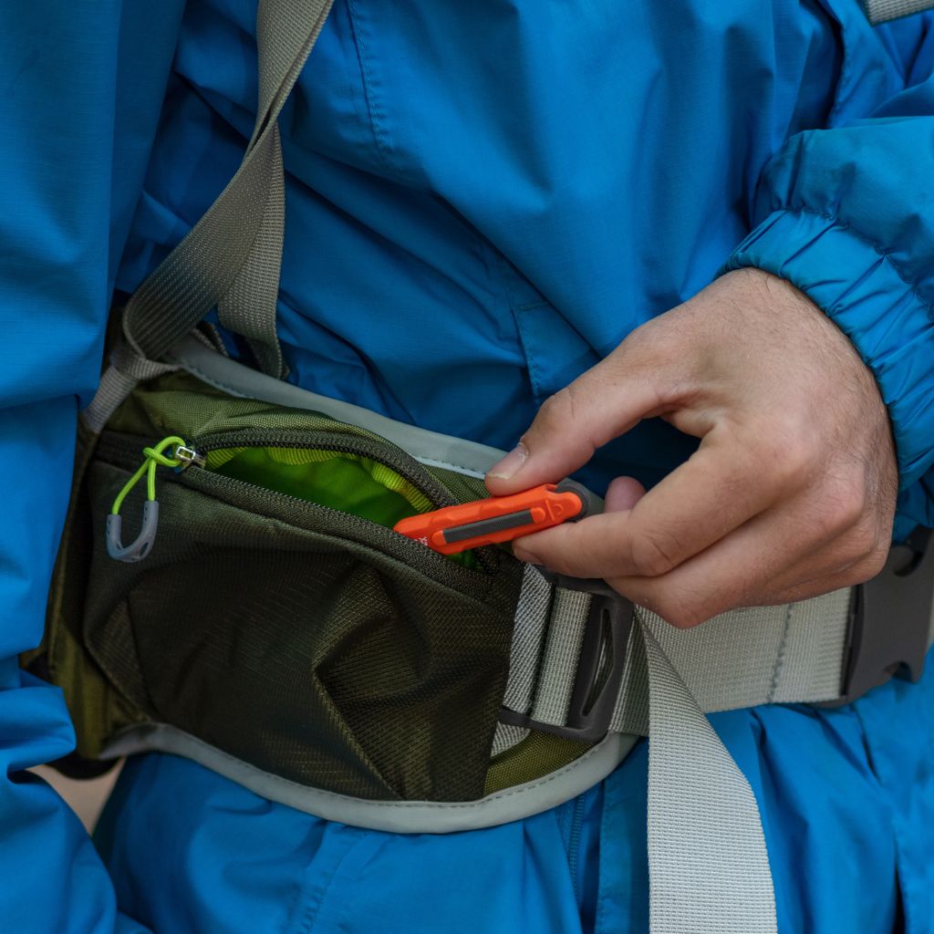 Fire Lite Micro Sparker pulling sparker out of hip pack