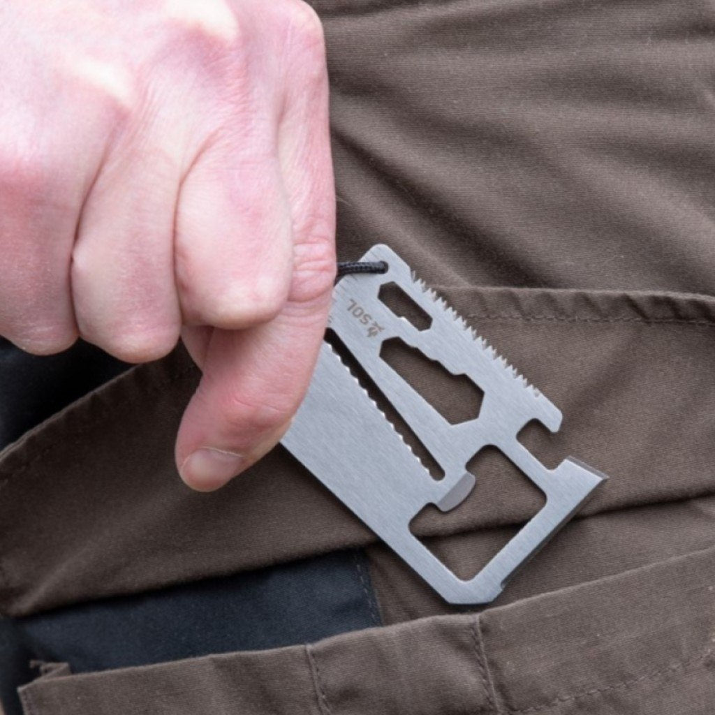 PackIt Survival Card Tool being put in a pocket