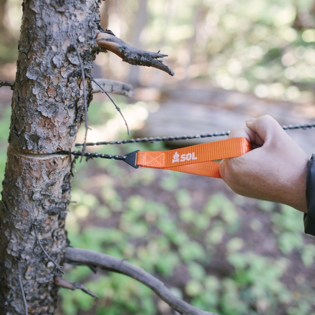 Pocket Chainsaw in use cutting a tree