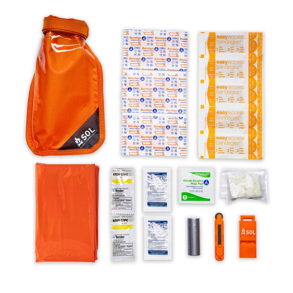 Survival Medic in Dry Bag contents displayed next to bag