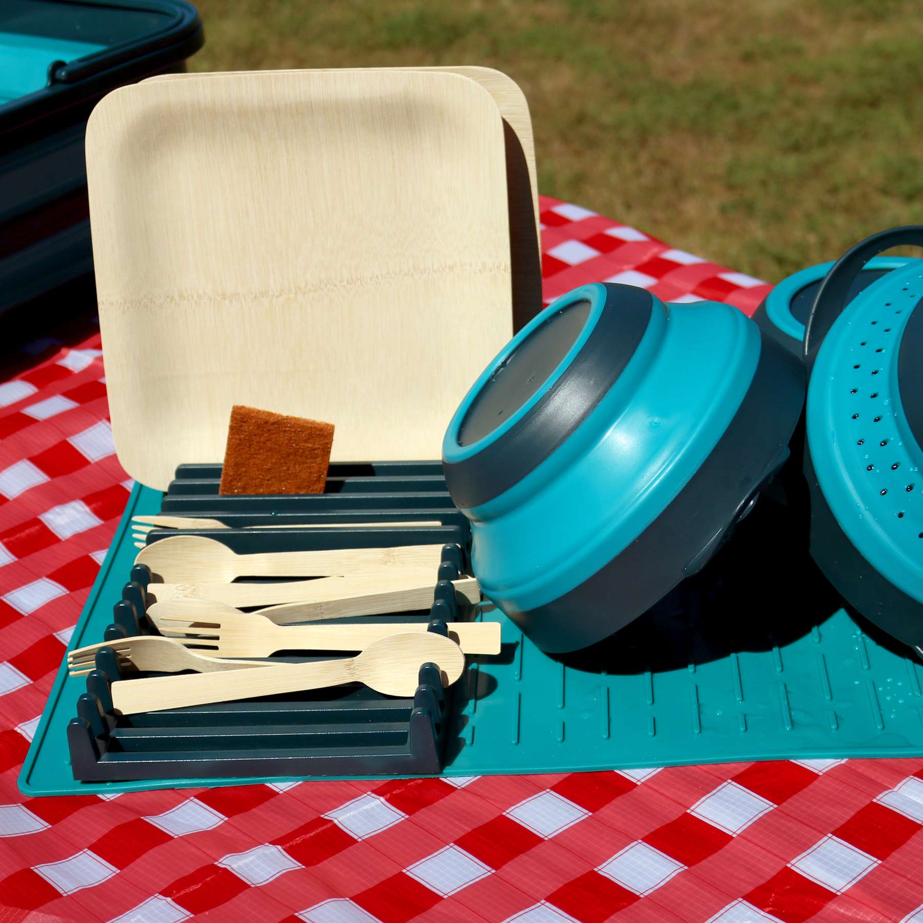 The image shows the Compact Dish Drying Rack in use with the AR Bamboo Dining Set and the AR Flat Pack Bowl and Strainer Set.