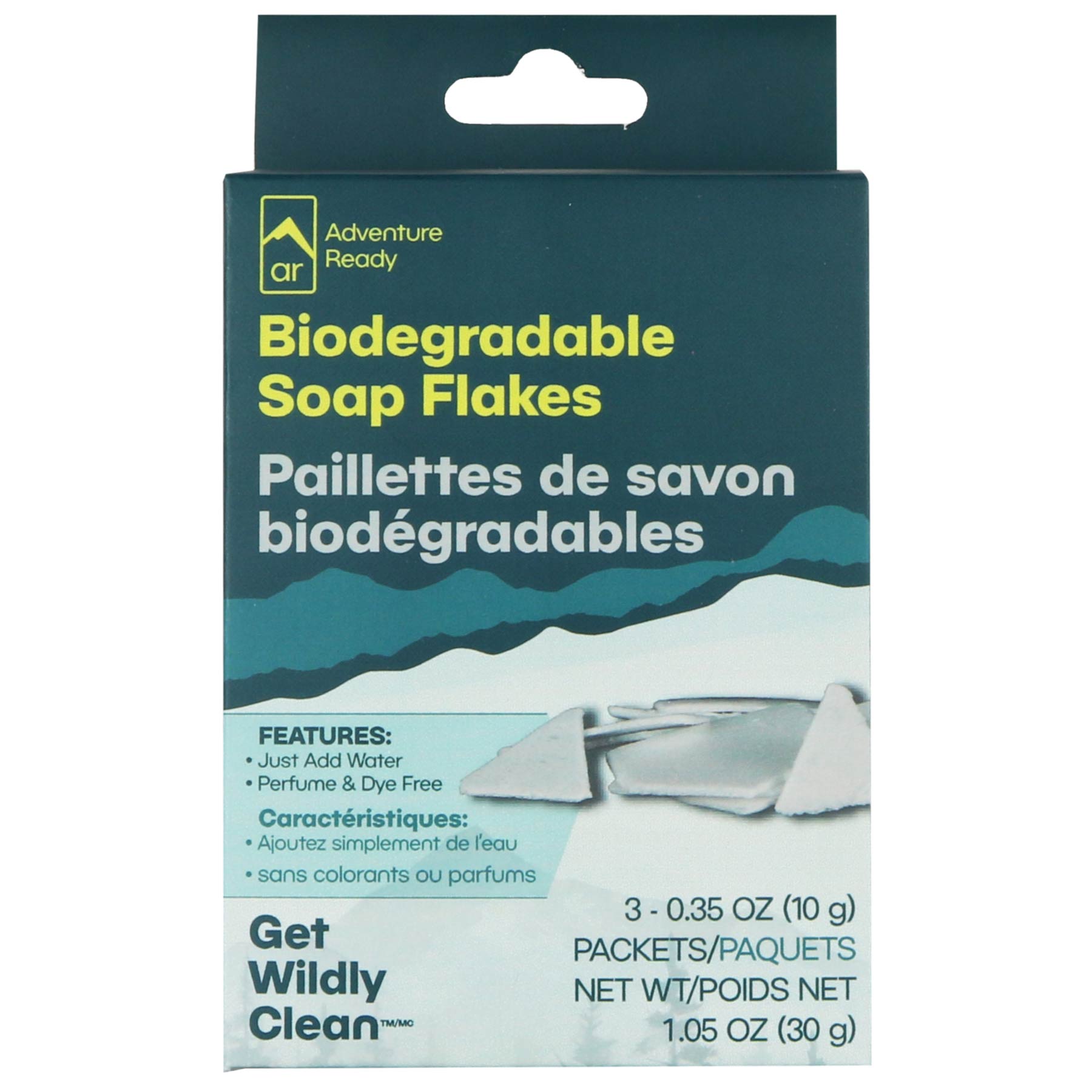 The Adventure Ready Biodegradable Soap Flakes packaging on a white background. On the box is the brand logo and product name. There is also a call out of the feature to just add water to the flakes, while it is also perfume and dye free. The box includes the brand tagline and a call out for the contents of 3 - 0.35oz packets and a net weight of 1.05oz. There are also 
French translations on the box.
