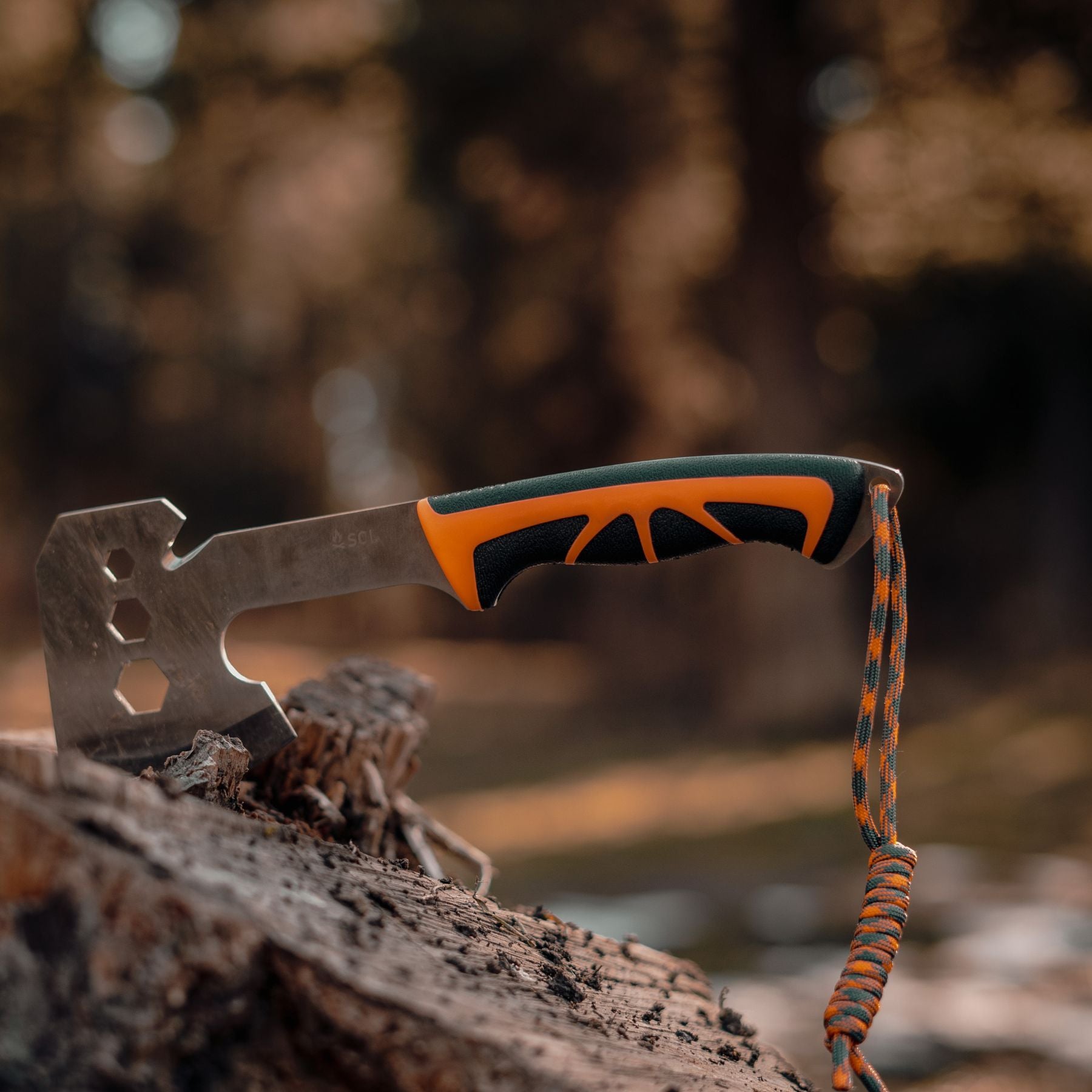 SOL Orange and Black Stoke Hatchet in Stump