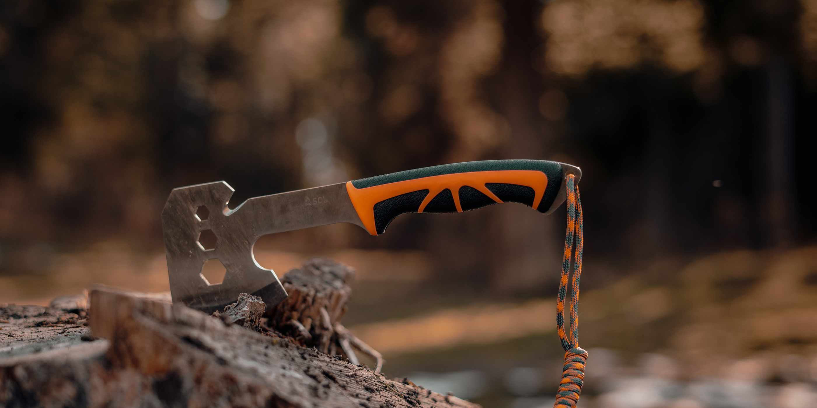 SOL Orange and Black Stoke Hatchet in Stump