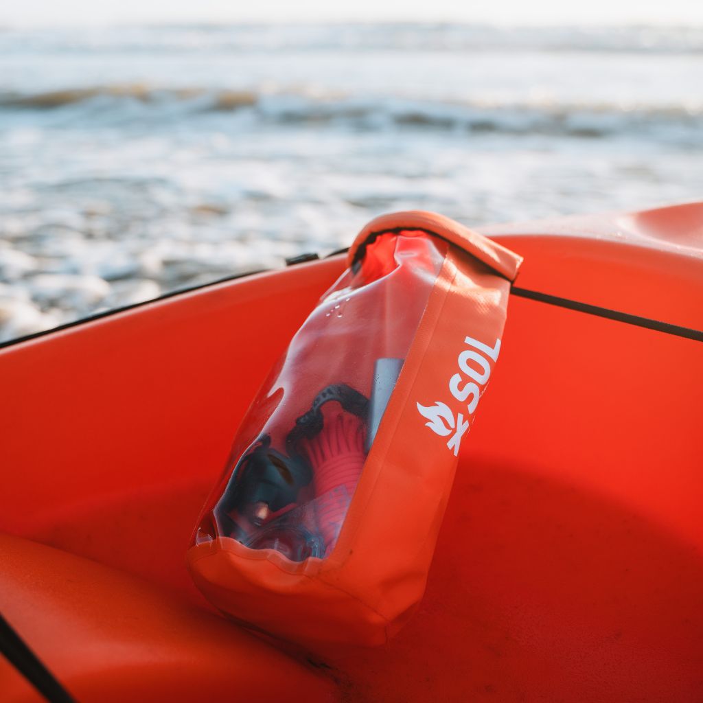 Adventure Ready Survival Kit sitting on orange kayak