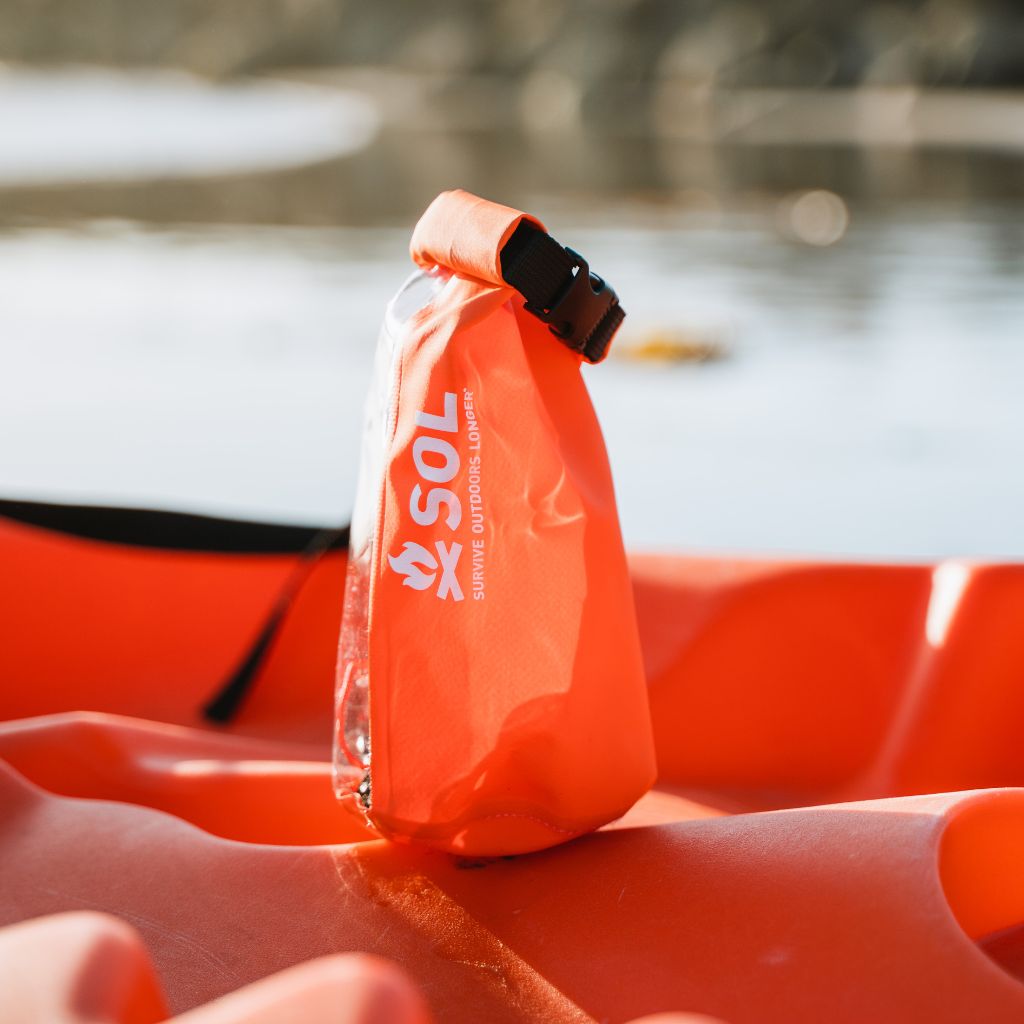Adventure Ready Survival Kit kit sitting on orange kayak