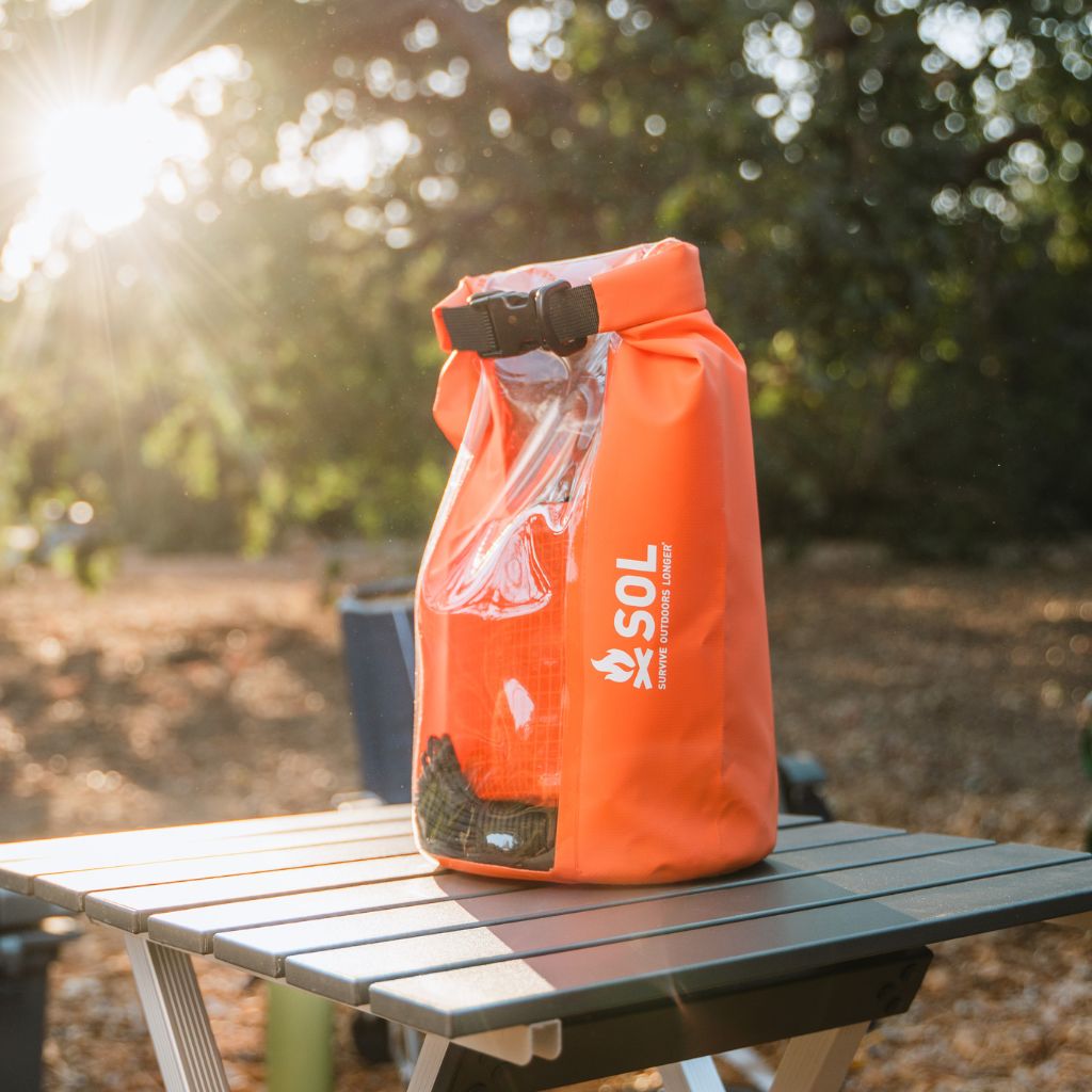 Camp Ready Survival Kit sitting on table in the outdoors