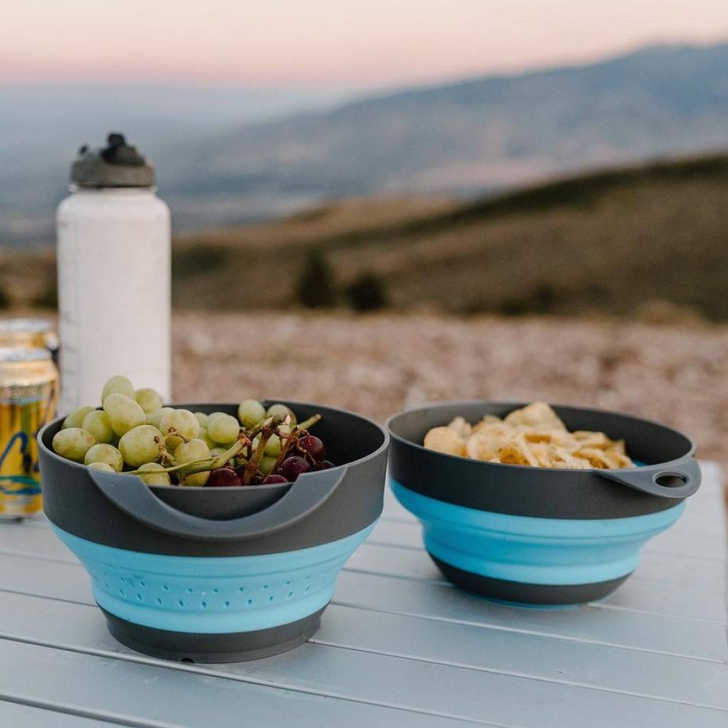 Flat Pack Bowls & Strainer Set filled with food on a table