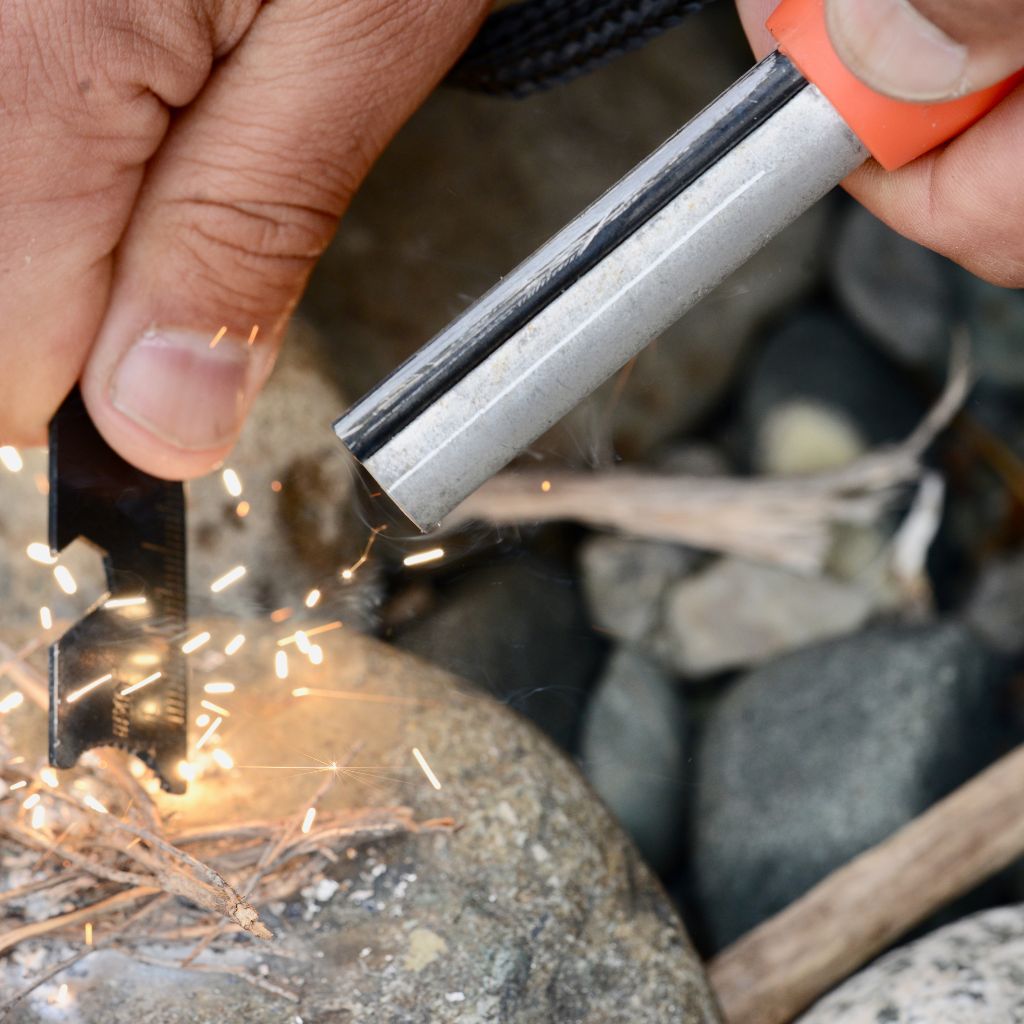 Mag Striker with Tinder Cord creating sparks on rock