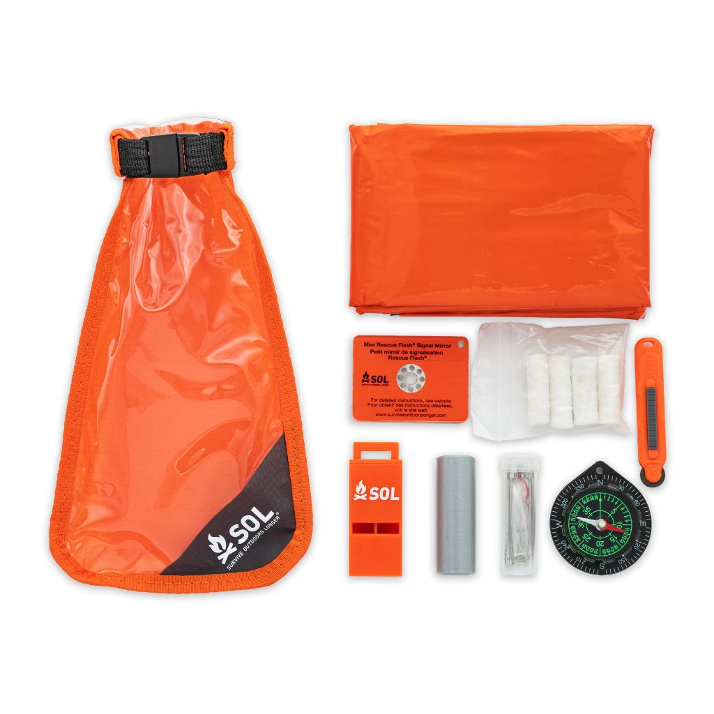 Scout Survival Kit contents laid out next to bag