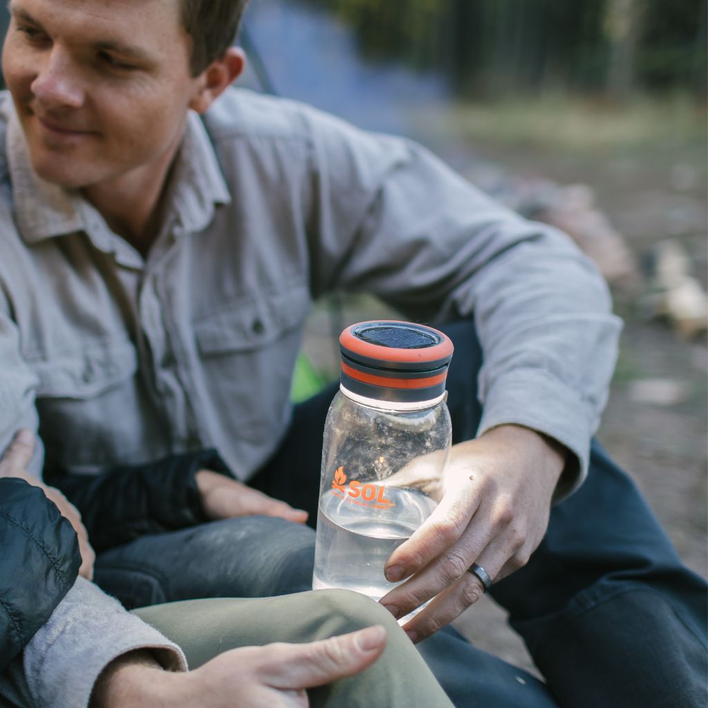 Venture Solar Water Bottle Lantern man holding while camping
