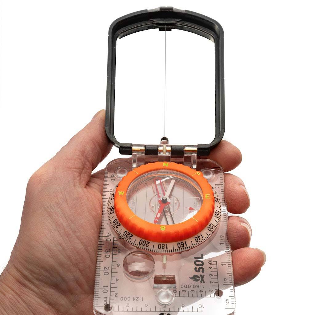 Sighting Compass with Mirror holding in hand